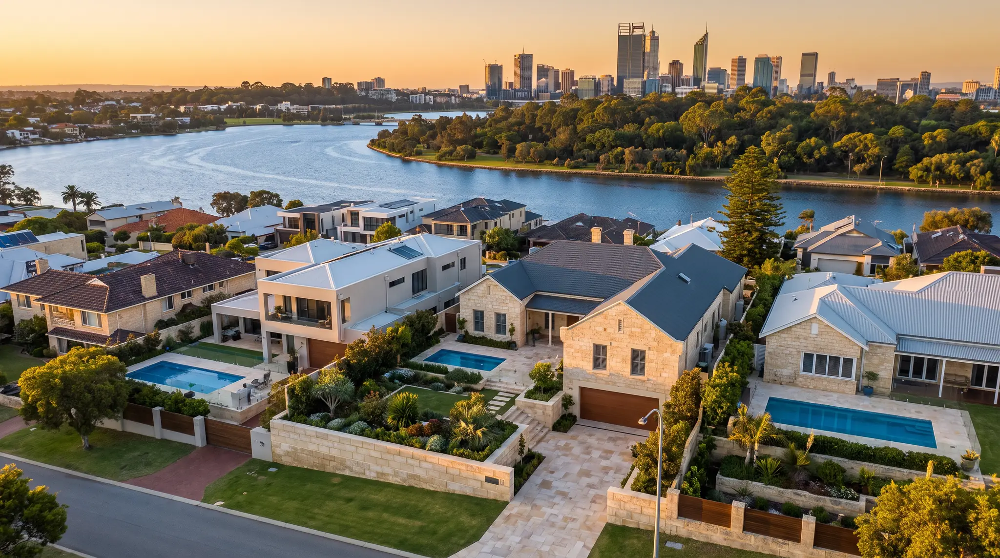 Perth riverside homes with pools, limestone walls and new paving, the Swan River and CBD beyond
